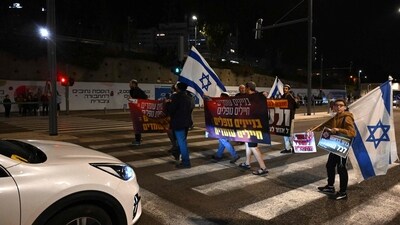 Israeli right wing protesters demonstrate near the Defence Ministry in Tel Aviv on December 16, 2023, close to another demonstration of friends and relatives of Israeli hostages held in Gaza since the October 7 attack. (AFP) Israeli right wing protesters demonstrate near the Defence Ministry in Tel Aviv on December 16, 2023, close to another demonstration of friends and relatives of Israeli hostages held in Gaza since the October 7 attack. (AFP)