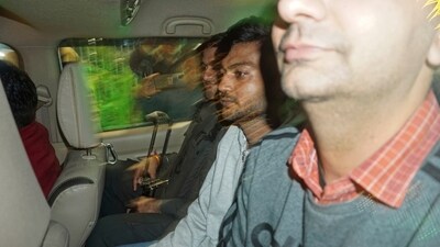 Sagar Sharma, center, an accused in the security breach in parliament, is escorted to be taken into police custody in New Delhi, (AP) Sagar Sharma, center, an accused in the security breach in parliament, is escorted to be taken into police custody in New Delhi, (AP)