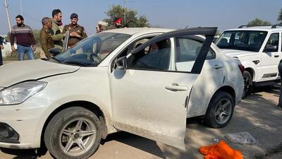 The stolen car that the gangsters were driving when the police intercepted them at Saneta in Sohana area of Mohali town on Saturday. (HT Photo)