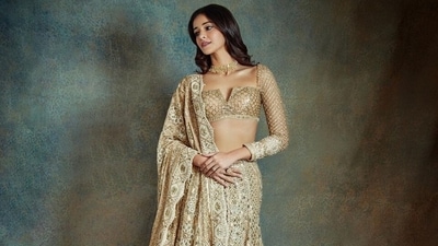 Ananya accessorised the ensemble with gold jewellery, including a choker, rings, and jhumkis. Lastly, she chose winged eyeliner, on-fleek brows, mascara-adorned lashes, mauve lip shade, rouge on the cheekbones, beaming highlighter, and subtle eye shadow. Centre-parted and open wavy locks gave Ananya's look a finishing touch. (Instagram) Ananya accessorised the ensemble with gold jewellery, including a choker, rings, and jhumkis. Lastly, she chose winged eyeliner, on-fleek brows, mascara-adorned lashes, mauve lip shade, rouge on the cheekbones, beaming highlighter, and subtle eye shadow. Centre-parted and open wavy locks gave Ananya's look a finishing touch. (Instagram)