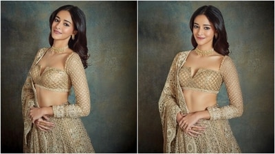 Celebrity stylist Tanya Ghavri shared Ananya's photos on Instagram with the caption, "Shimmering in Gold." The actor's lehenga is from the shelves of designer Tarun Tahiliani's eponymous label. She wore it to a family wedding. The ensemble features a full-sleeved blouse, a heavy lehenga and a scallop-border dupatta adorned in intricate chikankari kadhai and shimmering diamantes. (Instagram) Celebrity stylist Tanya Ghavri shared Ananya's photos on Instagram with the caption, "Shimmering in Gold." The actor's lehenga is from the shelves of designer Tarun Tahiliani's eponymous label. She wore it to a family wedding. The ensemble features a full-sleeved blouse, a heavy lehenga and a scallop-border dupatta adorned in intricate chikankari kadhai and shimmering diamantes. (Instagram)