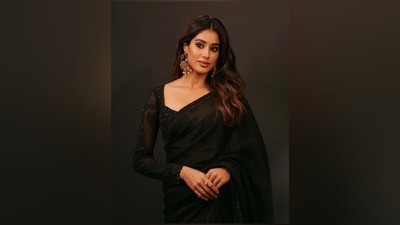 Meanwhile, Janhvi chose subtle smoky eye shadow, kohl-lined eyes, mascara on the lashes, feathered brows, glossy caramel-coloured lip shade, a dainty black bindi, bronzer on the cheekbones, subtle blush, and a dewy base for the glam picks.&nbsp; (Instagram)