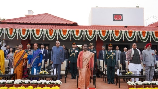 *President Droupadi Murmu with Vice President Jagdeep Dhankhar, Defence Minister Rajnath Singh and others attends 'At Home' reception on the eve of Vijay Diwas at Army House in New Delhi.(PTI)