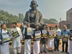Opposition MPs including suspended MPs stage a protest in front of the Mahatma Gandhi statue over the suspension of 14 MPs for the remainder of the Winter Session of Parliament. Opposition MPs including suspended MPs stage a protest in front of the Mahatma Gandhi statue over the suspension of 14 MPs for the remainder of the Winter Session of Parliament.