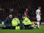 Luton Town's Tom Lockyer receives medical attention 