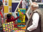 PM Modi interacts with child at Viksit Bharat Sankalp Yatra in Varanasi. PM Modi interacts with child at Viksit Bharat Sankalp Yatra in Varanasi.