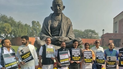 Opposition MPs including suspended MPs stage a protest in front of the Mahatma Gandhi statue over the suspension of 14 MPs for the remainder of the Winter Session of Parliament. (ANI) Opposition MPs including suspended MPs stage a protest in front of the Mahatma Gandhi statue over the suspension of 14 MPs for the remainder of the Winter Session of Parliament. (ANI)