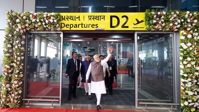 PM Modi waves to the crowd during the inauguration of the New Integrated Terminal Building of Surat Airport in Surat. Surat airport will not only become a gateway for international travellers but also facilitate seamless export-import operations for the thriving diamond and textile industries. (ANI) PM Modi waves to the crowd during the inauguration of the New Integrated Terminal Building of Surat Airport in Surat. Surat airport will not only become a gateway for international travellers but also facilitate seamless export-import operations for the thriving diamond and textile industries. (ANI)