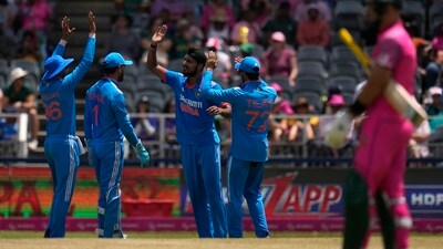 India's bowler Arshdeep Singh, centre, celebrates a wicket with teammates. (AP) India's bowler Arshdeep Singh, centre, celebrates a wicket with teammates. (AP)
