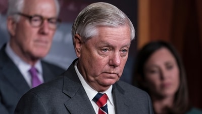 Sen. Lindsey Graham, R-S.C., flanked by Sen. John Cornyn, R-Texas, left, and Sen. Katie Britt, R-Ala., speaks to reporters as they criticize President Joe Biden's policies on the US-Mexico border, at the Capitol in Washington, Thursday, Dec. 7, 2023. Senate Republicans blocked the advance of tens of billions of dollars in military and economic assistance for Ukraine to broker a deal on Ukraine aid. (AP Photo/J. Scott Applewhite) (AP) Sen. Lindsey Graham, R-S.C., flanked by Sen. John Cornyn, R-Texas, left, and Sen. Katie Britt, R-Ala., speaks to reporters as they criticize President Joe Biden's policies on the US-Mexico border, at the Capitol in Washington, Thursday, Dec. 7, 2023. Senate Republicans blocked the advance of tens of billions of dollars in military and economic assistance for Ukraine to broker a deal on Ukraine aid. (AP Photo/J. Scott Applewhite) (AP)
