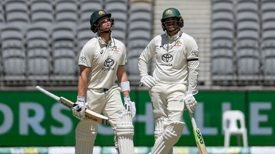 Steve Smith (L) and teammate Usman Khawaja wait for an LBW decision against Smith on day four of the first Test cricket match between Australia and Pakistan in Perth (AFP) Steve Smith (L) and teammate Usman Khawaja wait for an LBW decision against Smith on day four of the first Test cricket match between Australia and Pakistan in Perth (AFP)
