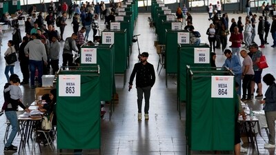 Voters line up at a polling station in Santiago, Chile. (AP) Voters line up at a polling station in Santiago, Chile. (AP)
