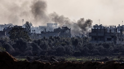 Smoke rises from damaged buildings, amid the ongoing ground operation of the Israeli army against Palestinian Islamist group Hamas, in the Gaza Strip, (REUTERS)