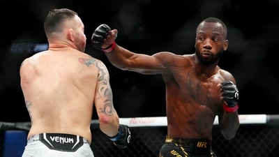 Dec 16, 2023; Las Vegas, Nevada, USA; Leon Edwards (red gloves) fights Colby Covington (blue gloves) during UFC 296 at T-Mobile Arena. Mandatory Credit: Stephen R. Sylvanie-USA TODAY Sports (USA TODAY Sports via Reuters Con)