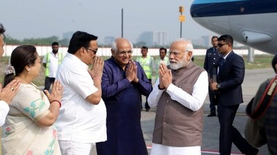 PM Modi was received by Gujarat Chief Minister Bhupendra Patel and State BJP President C.R. Paatil upon his arrival in Surat. (PTI) PM Modi was received by Gujarat Chief Minister Bhupendra Patel and State BJP President C.R. Paatil upon his arrival in Surat. (PTI)