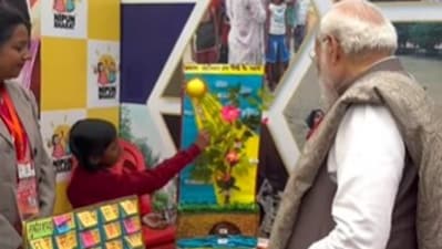 PM Modi interacts with child at Viksit Bharat Sankalp Yatra in Varanasi. PM Modi interacts with child at Viksit Bharat Sankalp Yatra in Varanasi.