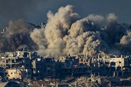 Smoke rises following an Israeli bombardment in the Gaza Strip, as seen from southern Israel on December 16. (AP) Smoke rises following an Israeli bombardment in the Gaza Strip, as seen from southern Israel on December 16. (AP)