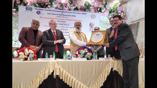 Haryana home minister Anil Vij during the launch of digital directory of Ambala Scientific Instrument Manufacturer Association on Saturday late evening. (HT Photo)