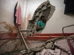Palestinian paramedics inspect damage in the patient rooms caused by the Israeli strikes on the maternity ward at Nasser Hospital in the town of Khan Younis, southern Gaza Strip, on December 17. Palestinian paramedics inspect damage in the patient rooms caused by the Israeli strikes on the maternity ward at Nasser Hospital in the town of Khan Younis, southern Gaza Strip, on December 17.
