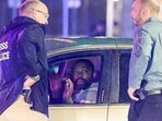 The car, a beige Ford, tried to continue into a closed-off intersection, before Secret Service personnel surrounded the vehicle with weapons and instructed the driver to put his hands up. The car, a beige Ford, tried to continue into a closed-off intersection, before Secret Service personnel surrounded the vehicle with weapons and instructed the driver to put his hands up.