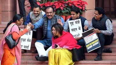 Suspended MPs stage a protest on the stairs of the Makar Dwar in the Parliament premises, in New Delhi. (ANI)