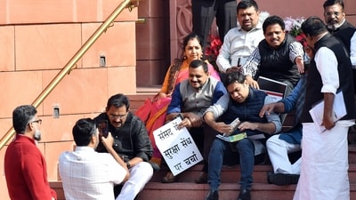 Earlier today, suspended MPs staged a protest on the stairs of the Makar Dwar in the Parliament premises, in New Delhi on Monday. (ANI Photo/Rahul Singh) Earlier today, suspended MPs staged a protest on the stairs of the Makar Dwar in the Parliament premises, in New Delhi on Monday. (ANI Photo/Rahul Singh)