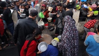 Palestinians collect free food handouts from a volunteer hospice in Rafah, southern Gaza, on Sunday, Dec. 17, 2023. More than 18,000�Palestinians�have been killed in Gaza since Israel retaliated after the Oct. 7 attack by Hamas militants with airstrikes and the ground assault, according to the health ministry in the Hamas-run enclave. Photographer: Ahmad Salem/Bloomberg (Bloomberg) Palestinians collect free food handouts from a volunteer hospice in Rafah, southern Gaza, on Sunday, Dec. 17, 2023. More than 18,000�Palestinians�have been killed in Gaza since Israel retaliated after the Oct. 7 attack by Hamas militants with airstrikes and the ground assault, according to the health ministry in the Hamas-run enclave. Photographer: Ahmad Salem/Bloomberg (Bloomberg)