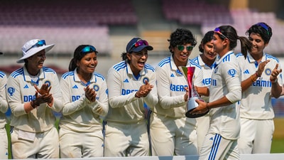 Navi Mumbai: Indian captain Harmanpreet Kaur carries the trophy after winning the one-off Test cricket match against England, at DY Patil Stadium, in Navi Mumbai, Saturday, Dec. 16, 2023. (PTI Photo/Kunal Patil)(PTI12_16_2023_000105B) (PTI)