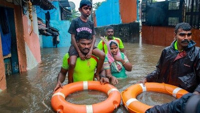 Tamil Nadu Fire and Rescue Services personnel rescue people from a flooded area after heavy rain, in Kanyakumari district, (PTI) Tamil Nadu Fire and Rescue Services personnel rescue people from a flooded area after heavy rain, in Kanyakumari district, (PTI)