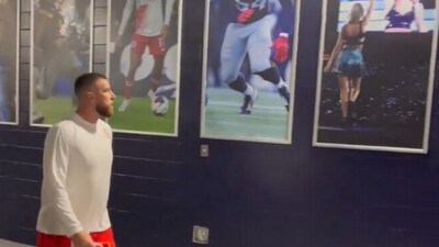 An adorable video shows Travis Kelce gazing at a photo of his girlfriend Taylor Swift before the Kansas City Chiefs vs. New England Patriots game (@NBCSCameraGuys screenshot/X) An adorable video shows Travis Kelce gazing at a photo of his girlfriend Taylor Swift before the Kansas City Chiefs vs. New England Patriots game (@NBCSCameraGuys screenshot/X)