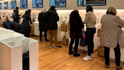 Shoppers at a Uniqlo store in New York use self-checkout on Wednesday, Dec. 6, 2023. Self-checkout faces a reckoning of sorts just as retailers are in the midst of their busiest time of the year. (AP Photo/Anne D'Innocenzio) Shoppers at a Uniqlo store in New York use self-checkout on Wednesday, Dec. 6, 2023. Self-checkout faces a reckoning of sorts just as retailers are in the midst of their busiest time of the year. (AP Photo/Anne D'Innocenzio)