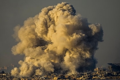Smoke rises following an Israeli bombardment in the Gaza Strip, as seen from southern Israel on December 16. (AP) Smoke rises following an Israeli bombardment in the Gaza Strip, as seen from southern Israel on December 16. (AP)