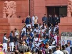 Suspended Opposition MPs stage a protest at the Makar Dwar after the suspension of 141 MPs for the remainder of the ongoing winter session of Parliament, in New Delhi on Tuesday. (ANI Photo) Suspended Opposition MPs stage a protest at the Makar Dwar after the suspension of 141 MPs for the remainder of the ongoing winter session of Parliament, in New Delhi on Tuesday. (ANI Photo)