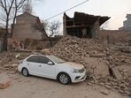 A vehicle is partially covered by a collapsed building in the aftermath of an earthquake in Dahejia village of Jishishan county in northwestern China's Gansu province on December 19. A vehicle is partially covered by a collapsed building in the aftermath of an earthquake in Dahejia village of Jishishan county in northwestern China's Gansu province on December 19.
