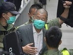 Jimmy Lai: Democracy advocate Jimmy Lai, center, leaves the Hong Kong's Court of Final Appeal.