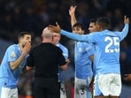 Manchester City's Erling Braut Haaland with teammates remonstrate with referee Simon Hooper