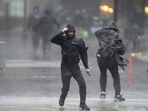 Pedestrians are buffeted by wind and rain as they cross a street, Monday, Dec. 18, 2023, in Boston. A storm moving up the East Coast brought heavy rain and high winds to the Northeast on Monday, threatening flooding, knocking out power to hundreds of thousands. (AP Photo/Steven Senne) Pedestrians are buffeted by wind and rain as they cross a street, Monday, Dec. 18, 2023, in Boston. A storm moving up the East Coast brought heavy rain and high winds to the Northeast on Monday, threatening flooding, knocking out power to hundreds of thousands. (AP Photo/Steven Senne)