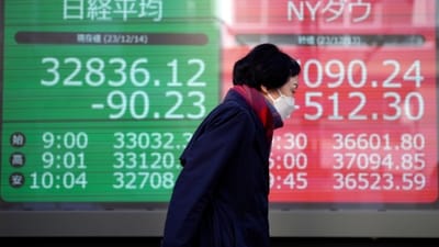 A person walks near an electronic stock board showing Japan's Nikkei 225, left, and New York Dow indexes at a securities firm Thursday, Dec. 14, 2023, in Tokyo. Shares are mostly higher in Asia after a powerful rally across Wall Street sent the Dow Jones Industrial Average to a record high as the Federal Reserve indicated that interest rate cuts are likely next year.(AP Photo/Eugene Hoshiko) (AP) A person walks near an electronic stock board showing Japan's Nikkei 225, left, and New York Dow indexes at a securities firm Thursday, Dec. 14, 2023, in Tokyo. Shares are mostly higher in Asia after a powerful rally across Wall Street sent the Dow Jones Industrial Average to a record high as the Federal Reserve indicated that interest rate cuts are likely next year.(AP Photo/Eugene Hoshiko) (AP)