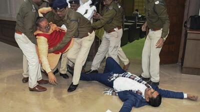 Jharkhand BJP MLAs Bhanu Pratap Sahi and Biranchi Narayan being removed by Assembly Marshals after their protest inside the House on Tuesday. (PTI)