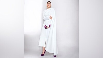 For accessories, Kriti chose an embellished purple clutch, gold heart-shaped earrings, and a pearl-adorned ring. Lastly, Kriti chose striking purple lip shade, mascara on the lashes, a muted mauve eye shadow, feathered brows, rouge on the cheekbones, highlighter on the contours, and a dewy base. A pulled-back updo with a few strands sculpting her face gave the finishing touch.&nbsp; (Instagram)