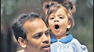 Mumbai, India, June 16, 2014: A child yawns in the arms of her father minutes before attending the first day of her school at Dadar, Mumbai, India on Monday, June 16, 2014. Mumbai schools reopen today after the two-month summer vacation. (Photo by Kalpak Pathak / Hindustan Times) (Hindustan Times) Mumbai, India, June 16, 2014: A child yawns in the arms of her father minutes before attending the first day of her school at Dadar, Mumbai, India on Monday, June 16, 2014. Mumbai schools reopen today after the two-month summer vacation. (Photo by Kalpak Pathak / Hindustan Times) (Hindustan Times)