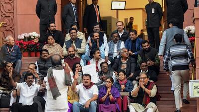Opposition MPs, who were suspended from the Parliament for the remainder of the Winter Session, stage a protest. (ANI) Opposition MPs, who were suspended from the Parliament for the remainder of the Winter Session, stage a protest. (ANI)