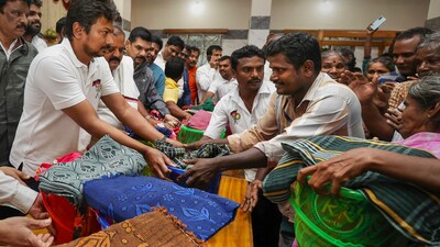 Tamil Nadu Youth Affairs and Sports Development Minister Udhayanidhi Stalin distributed relief material to flood affected people at the relief camp in Tirunelveli on Monday. (PTI) Tamil Nadu Youth Affairs and Sports Development Minister Udhayanidhi Stalin distributed relief material to flood affected people at the relief camp in Tirunelveli on Monday. (PTI)