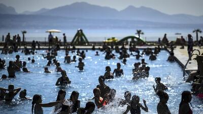 People cool off in the water during hot weather at the public swimming pool Bellerive on the shore of the Geneva Lake, in Lausanne, Switzerland, on August 23. (AP) People cool off in the water during hot weather at the public swimming pool Bellerive on the shore of the Geneva Lake, in Lausanne, Switzerland, on August 23. (AP)