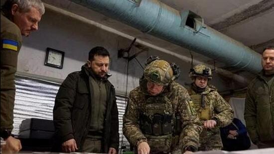 Ukraine’s President Volodymyr Zelenskiy listens to Commander of the Ground Forces colonel general Oleksandr Syrskyi. (Reuters)