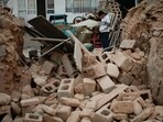 Gansu Earthquake: A boy stands amongst the rubble of his collapsed house in Dahejia in Jishishan County in northwest China's Gansu province. Gansu Earthquake: A boy stands amongst the rubble of his collapsed house in Dahejia in Jishishan County in northwest China's Gansu province.