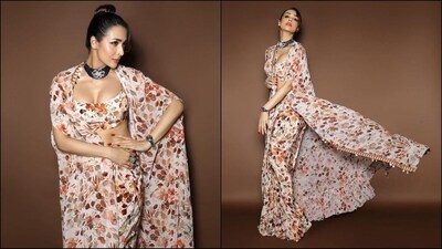 Malaika Arora is one of those actresses who is definitely getting hotter day by day. The stunner keeps raising the temperature with her glamorous looks. Whether it's a chic pantsuit or a sartorial saree, Malaika knows how to turn heads. She is quite active on social media and her Insta-diaries filled with fashion-forward looks are nothing short of a treasure trove of style inspiration. Her latest look in a stunning printed ensemble is no exception and is sure to inspire your ethnic wardrobe. Scroll down to take notes. (Instagram/@aasthasharma) Malaika Arora is one of those actresses who is definitely getting hotter day by day. The stunner keeps raising the temperature with her glamorous looks. Whether it's a chic pantsuit or a sartorial saree, Malaika knows how to turn heads. She is quite active on social media and her Insta-diaries filled with fashion-forward looks are nothing short of a treasure trove of style inspiration. Her latest look in a stunning printed ensemble is no exception and is sure to inspire your ethnic wardrobe. Scroll down to take notes. (Instagram/@aasthasharma)