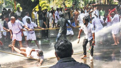Many of the demonstrations in Kerala turned violent as activists of the Youth Congress clashed with the police in riot gear, braved water cannons and climbed atop barricades to raise slogans. (PTI) Many of the demonstrations in Kerala turned violent as activists of the Youth Congress clashed with the police in riot gear, braved water cannons and climbed atop barricades to raise slogans. (PTI)