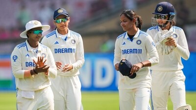 Indian captain Harmanpreet Kaur with teammates after winning the one-off Test cricket match against England. (PTI) Indian captain Harmanpreet Kaur with teammates after winning the one-off Test cricket match against England. (PTI)