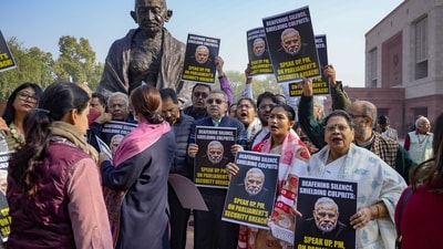 Suspended MPs during their protest in the Winter session of Parliament, in New Delhi, Tuesday, Dec. 19, 2023. (PTI) Suspended MPs during their protest in the Winter session of Parliament, in New Delhi, Tuesday, Dec. 19, 2023. (PTI)